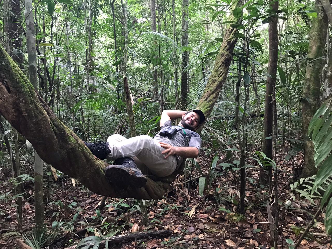 Field naturalist at rest in primary Amazon forest