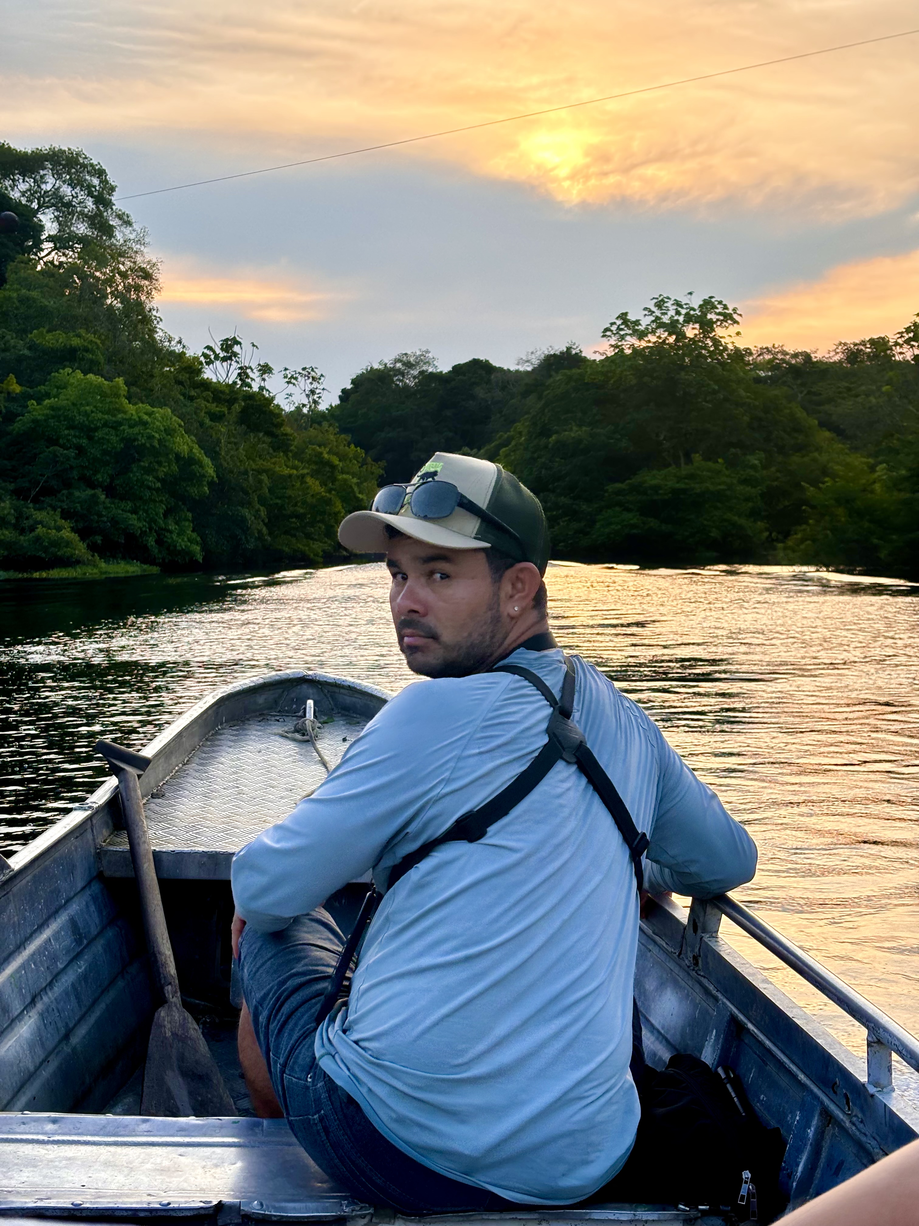 Edson Roberto, founder of Amazon Eco Travellers, on the river at sunset